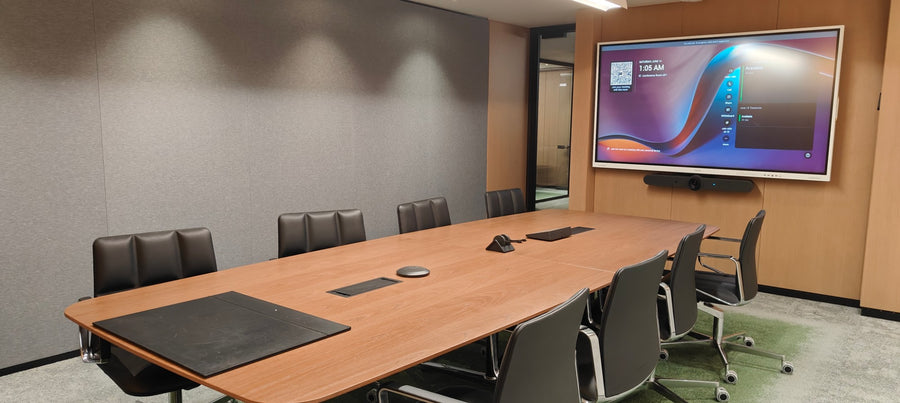 Executive boardroom in India with a Samsung interactive display running Microsoft Teams Rooms, integrated video bar, ceiling microphone, and touch controller for one-touch AV control