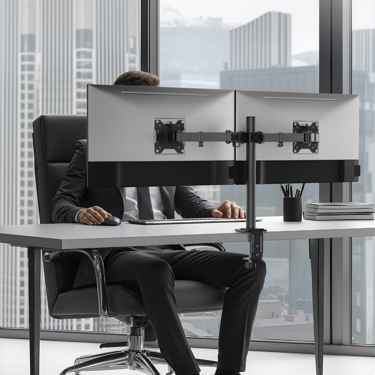 Lumi LDT110-C024 articulating monitor arm installed holding a monitor on a desk in an office setup