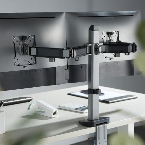 Lumi LDT55-C024 articulating monitor arm installed holding a monitor on a desk in an office setup