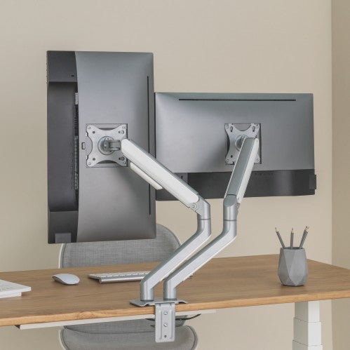 Lumi LDT63-C024 mechanical spring monitor arm installed holding a monitor on a desk in an office setup