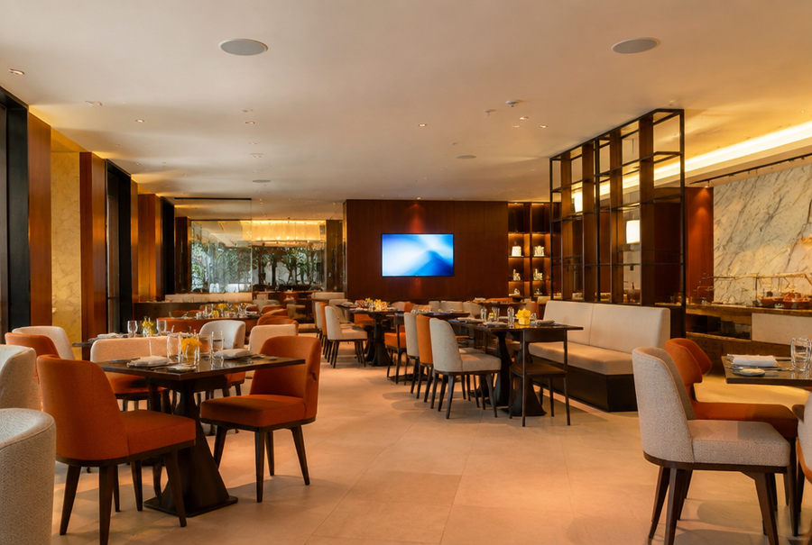 Hotel restaurant AV setup in India with ambient audio and a display for guest experience